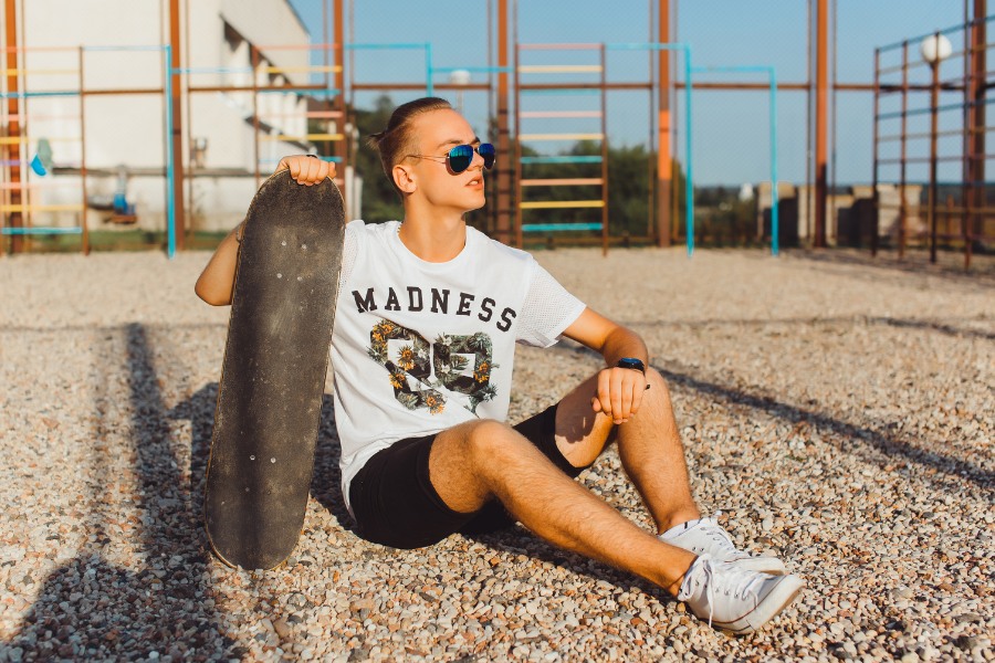 A person wearing a bold black graphic t-shirt from a premium online shop for men’s graphic tees online UK.